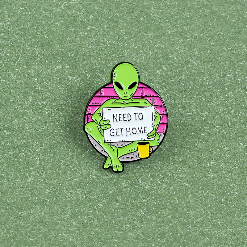 Green Alien Reading Newspaper Brooch