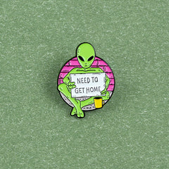 Green Alien Reading Newspaper Brooch