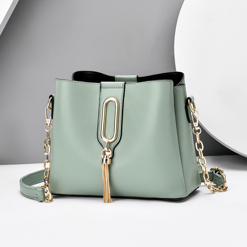 Stylish Bucket Bag with Chain Crossbody Strap and Tassel Detail