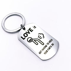 Love Is Not Holding Your Farts Keychain