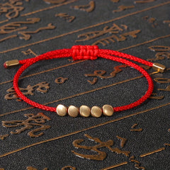 Handwoven Red Rope Bracelet with Copper Beads